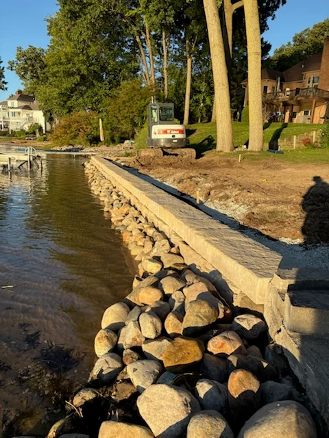 Riprap stone and geotextile fabric installed along waterfront erosion control project